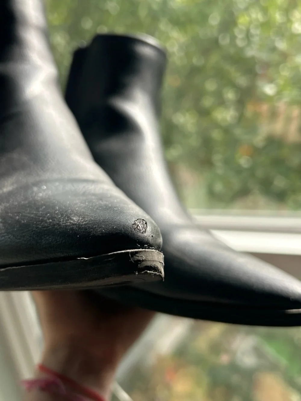 Black leather ankle boots with pointed toe and block heel